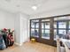 Bright sunroom offering outdoor access and versatile space for relaxation or hobbies with neutral paint and flooring at 7360 Ulmerton Rd # 18A, Largo, FL 33771