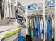 Organized walk-in closet with shelves, hanging rods, and storage for clothes, shoes, and other personal items at 7360 Ulmerton Rd # 18A, Largo, FL 33771