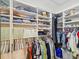 Spacious walk-in closet with ample shelving, hanging rods, and storage for clothing at 7360 Ulmerton Rd # 18A, Largo, FL 33771