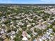 Overhead view of residential neighborhood with tree coverage and community amenities at 8020 24Th Ave N, St Petersburg, FL 33710