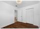 Bedroom featuring laminate floors, a closet, and a modern light fixture at 8020 24Th Ave N, St Petersburg, FL 33710