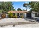 Charming single-story home with a well-manicured front yard and mature landscaping at 8020 24Th Ave N, St Petersburg, FL 33710