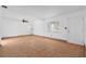 Spacious living room with tile flooring, ceiling fan, and a large window at 8020 24Th Ave N, St Petersburg, FL 33710