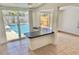 Bright sunroom with sliding glass doors leading to a sparkling blue swimming pool at 8020 24Th Ave N, St Petersburg, FL 33710