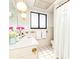 Stylish bathroom with a shower, tile flooring, and bright lighting fixtures at 8020 28Th N Ave, St Petersburg, FL 33710