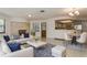 A comfortable living room with a fireplace and an adjacent dining area, perfect for entertaining at 8020 28Th N Ave, St Petersburg, FL 33710
