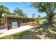 Inviting patio with a stainless steel grill and an outdoor dining set perfect for entertaining in the backyard at 8020 28Th N Ave, St Petersburg, FL 33710