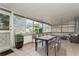 Enclosed sun room perfect for dining and relaxation at 8020 28Th N Ave, St Petersburg, FL 33710