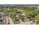 Aerial view of a bright home surrounded by mature trees and lush landscaping at 8095 35Th Ave N, St Petersburg, FL 33710