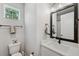 Stylish half bathroom with modern vanity, sleek fixtures, and ample natural light at 8095 35Th Ave N, St Petersburg, FL 33710