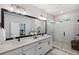 Modern bathroom with double vanity, tiled shower, and elegant fixtures at 8095 35Th Ave N, St Petersburg, FL 33710