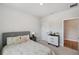 Cozy bedroom featuring neutral decor, a comfortable bed, and soft carpet at 8095 35Th Ave N, St Petersburg, FL 33710