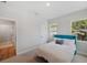 Bedroom with natural light and access to bathroom with tile flooring at 8095 35Th Ave N, St Petersburg, FL 33710