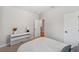 Bedroom featuring a side table with lamp and an open doorway at 8095 35Th Ave N, St Petersburg, FL 33710