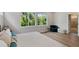 A bedroom with bright natural light, wood floors, and ample space at 8095 35Th Ave N, St Petersburg, FL 33710