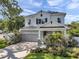 Charming two story home with a two-car garage, manicured landscaping, and solar panels at 8095 35Th Ave N, St Petersburg, FL 33710