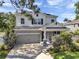 Stately two story home with manicured landscaping, a two car garage and gray stone accents at 8095 35Th Ave N, St Petersburg, FL 33710