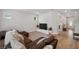 Large sectional sofa featured in the living room with wood floors and recessed lighting at 8095 35Th Ave N, St Petersburg, FL 33710