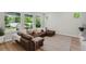 Spacious living room area with large sectional couch and an abundance of natural light at 8095 35Th Ave N, St Petersburg, FL 33710