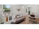 Open living room design featuring wood floors, light walls, and modern décor at 8095 35Th Ave N, St Petersburg, FL 33710