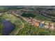 Aerial view of a golf community surrounded by lush fairways, ponds, and beautiful homes at 8223 Haven Harbour Way, Bradenton, FL 34212