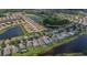 Aerial view showing residential neighborhood, lakes, and golf course on a sunny day at 8223 Haven Harbour Way, Bradenton, FL 34212