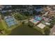 An aerial shot showcasing community amenities including a pool, tennis courts, and a sand volleyball court at 8223 Haven Harbour Way, Bradenton, FL 34212