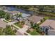 A lush front yard, palm trees, and a paved driveway complement this home in a lovely neighborhood at 8223 Haven Harbour Way, Bradenton, FL 34212