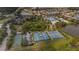 An aerial shot capturing a community with sports courts, swimming pool, and lush green spaces at 8223 Haven Harbour Way, Bradenton, FL 34212