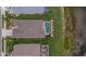 Aerial view of a home with a screened-in pool, lush lawn and proximity to a tranquil pond at 8223 Haven Harbour Way, Bradenton, FL 34212