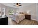 Comfortable bedroom featuring wood-look floors and natural lighting at 8223 Haven Harbour Way, Bradenton, FL 34212