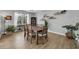 Inviting dining room with a large wooden table, seating for eight, and stylish decor at 8223 Haven Harbour Way, Bradenton, FL 34212