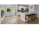 Bright kitchen featuring stainless appliances, white cabinetry, and a large center island with seating at 8223 Haven Harbour Way, Bradenton, FL 34212