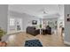 Bright living room with hardwood floors, neutral colors, modern furniture, and french doors at 8223 Haven Harbour Way, Bradenton, FL 34212