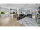 Open-concept living room and kitchen offering a modern and spacious living area with wood floors and neutral tones at 8223 Haven Harbour Way, Bradenton, FL 34212
