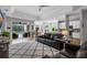 Spacious living room open to kitchen and dining area with sliding glass doors to backyard at 8223 Haven Harbour Way, Bradenton, FL 34212