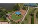 Aerial view of a playground with slides and a swing set under a blue shade canopy at 8223 Haven Harbour Way, Bradenton, FL 34212