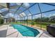 Sparkling screened-in pool with picturesque lake views, perfect for relaxation and outdoor enjoyment at 8223 Haven Harbour Way, Bradenton, FL 34212