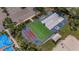 Aerial view of shuffleboard area, with checkerboard and bocce ball court next to volleyball court at 8223 Haven Harbour Way, Bradenton, FL 34212