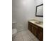Bathroom featuring tile floors, vanity, and toilet at 8618 N Orangeview Ave, Tampa, FL 33617