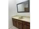 Bathroom featuring vanity with dark wood cabinets at 8618 N Orangeview Ave, Tampa, FL 33617