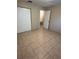Bedroom with a closet and access to the bathroom at 8618 N Orangeview Ave, Tampa, FL 33617