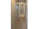 Hallway with neutral colored walls and tile flooring at 8618 N Orangeview Ave, Tampa, FL 33617