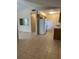 Open-concept living area with tile floors connecting to the kitchen at 8618 N Orangeview Ave, Tampa, FL 33617