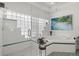 Bright bathroom featuring a glass-enclosed shower, large soaking tub and decorative wall art at 8708 Laurel N Dr, Pinellas Park, FL 33782