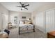 Cozy bedroom with natural light, ceiling fan, and carpeted floors at 8708 Laurel N Dr, Pinellas Park, FL 33782