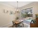 Cozy dining area with natural light and views of the pool at 8708 Laurel N Dr, Pinellas Park, FL 33782