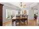 Dining area with a bay window, hardwood floors, and natural light at 8708 Laurel N Dr, Pinellas Park, FL 33782