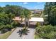 Lush landscaping surrounds the secure entry gates, offering privacy and security for residents at 8708 Laurel N Dr, Pinellas Park, FL 33782