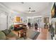 Cozy living room featuring a fireplace, comfortable seating, and an open floor plan at 8708 Laurel N Dr, Pinellas Park, FL 33782